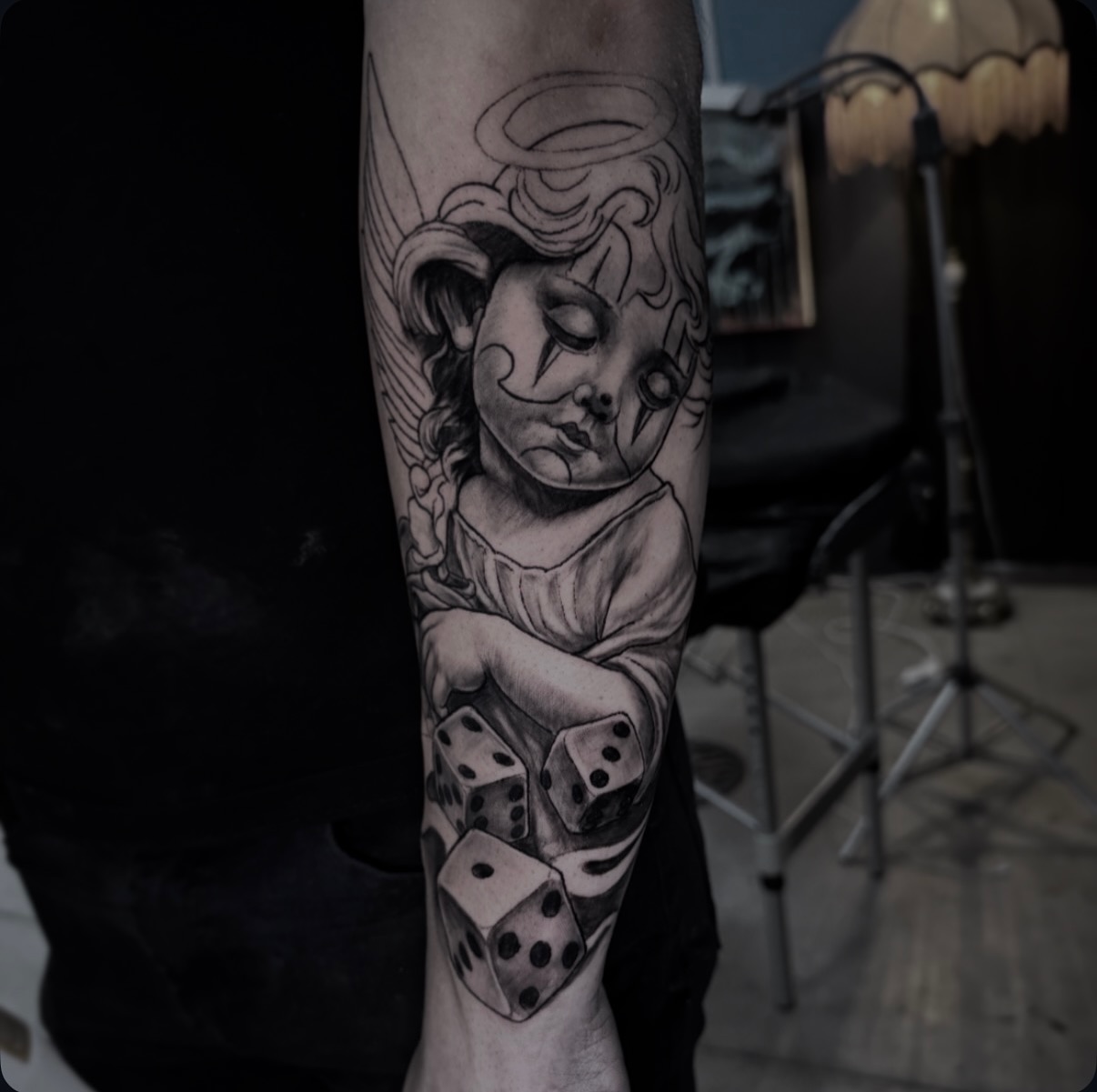 Cherub & Dice Forearm — Blackwork tattoo by moss